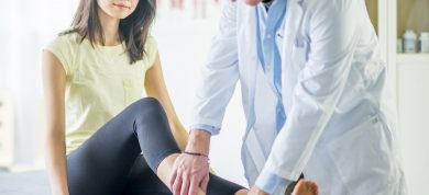 woman with ankle pain seeing doctor